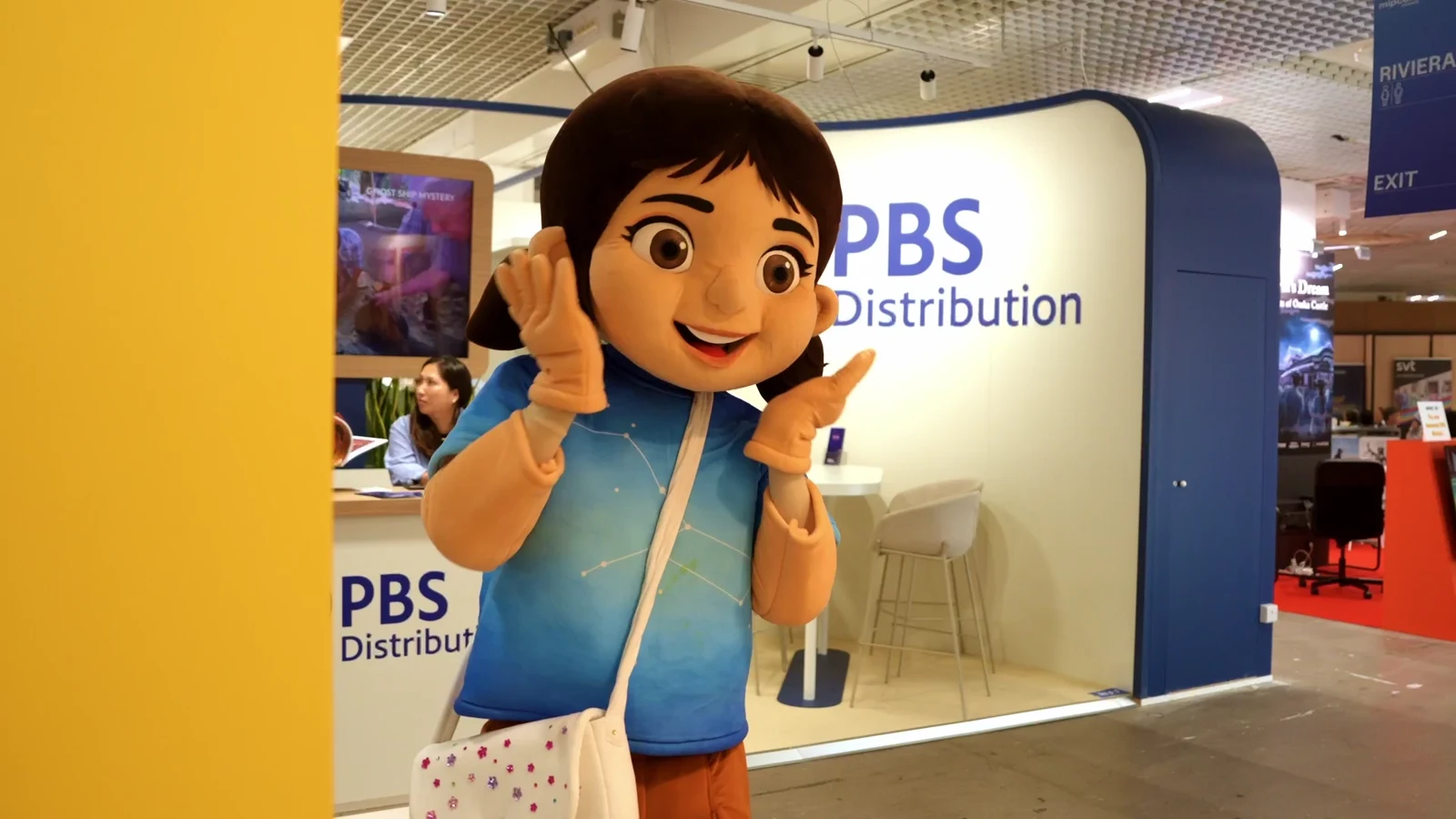 Raaya’s mascot waves at MIPCOM Cannes.